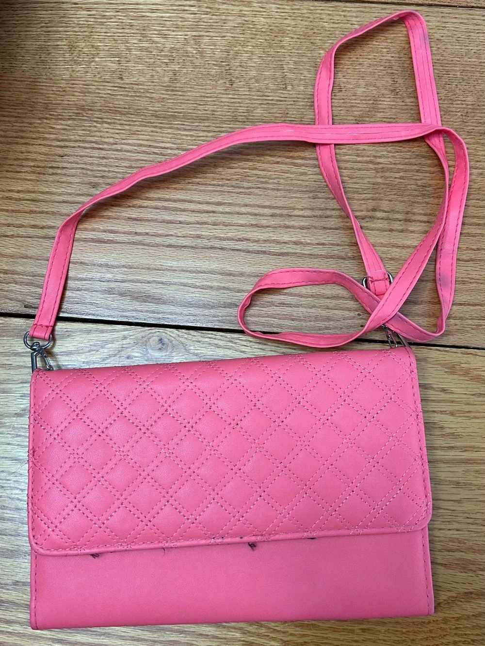 Pink wallet purse with shoulder strap and clasp